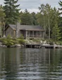 Lakefront cottage with a dock on a granite shore. Generated sample photograph.